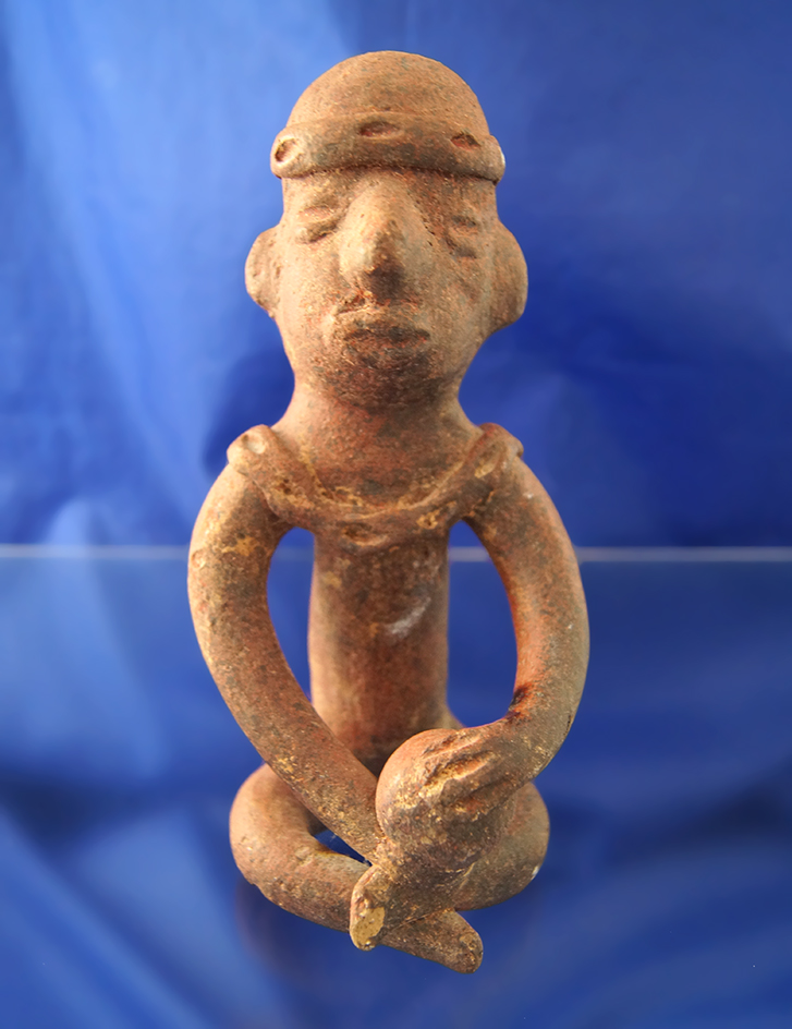 6 1/2" Colima pottery figure of a man making pottery, West Mexico.