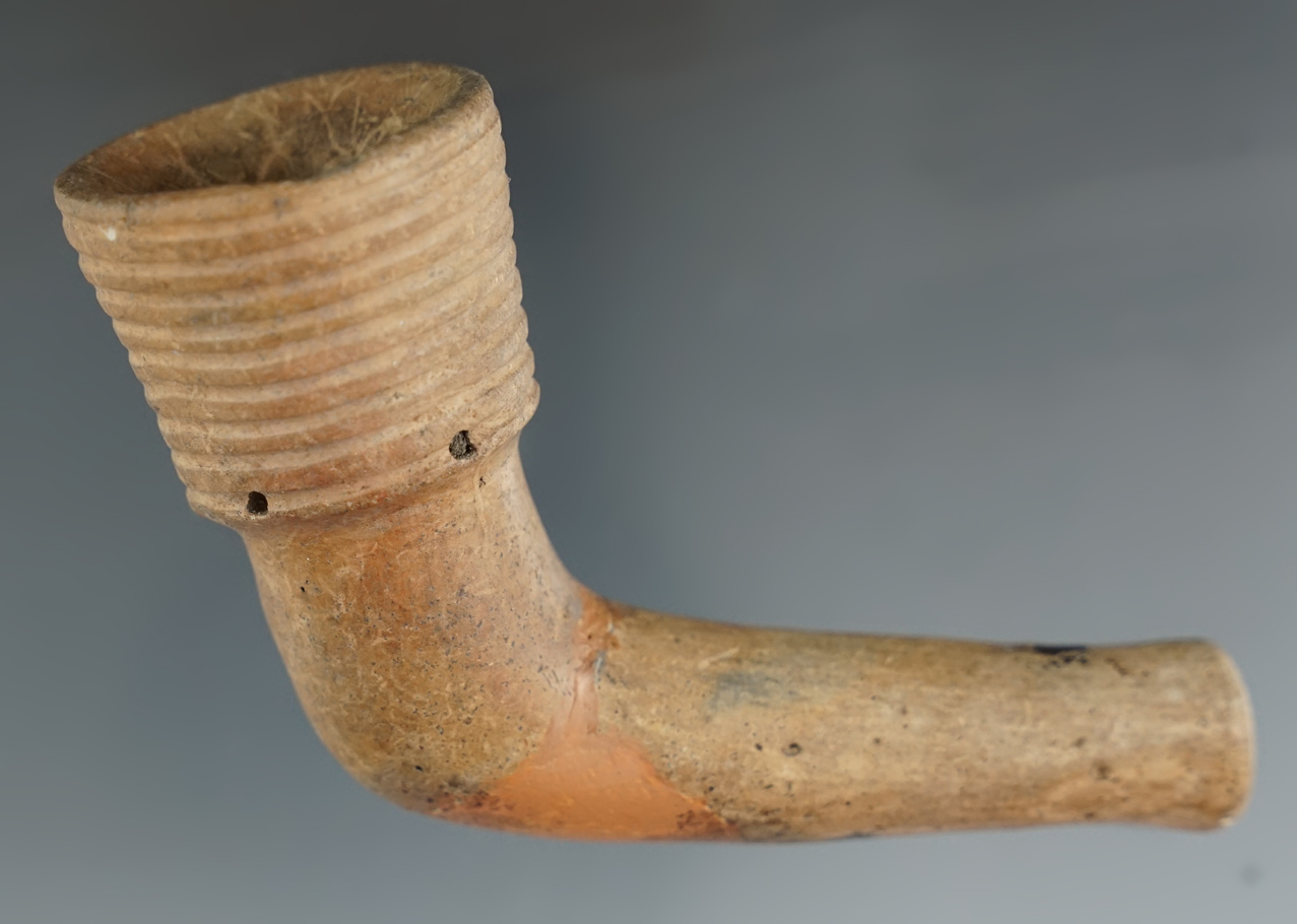 Well styled 4" Iroquois clay ring bowl pipe with a broken and mended elbow area.New York.