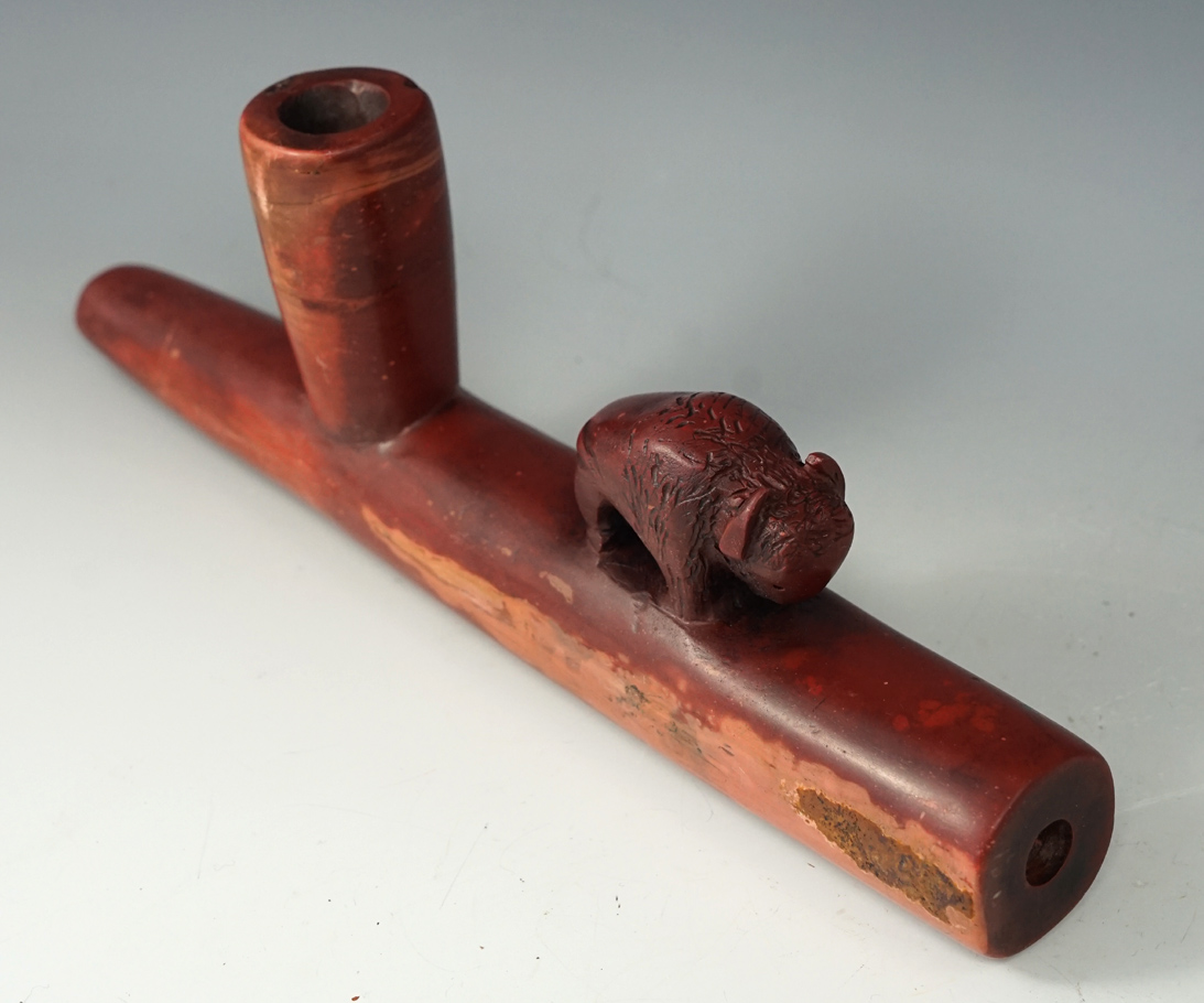 Circa 1930's - 40's 9 3/4" Long Catlinite Pipe with a buffalo effigy that is nicely made.