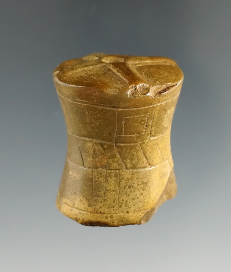 Sale highlight. 1 1/2" highly patinated fully engraved Pipestone Spool, very rare to get pipestone o