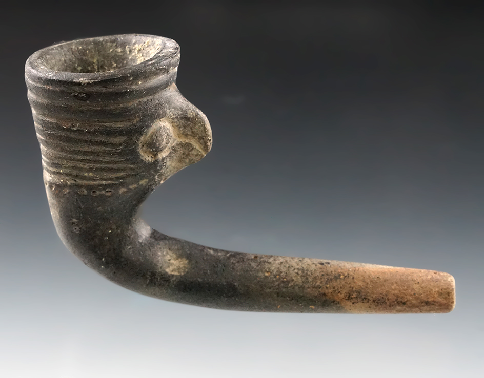 4" Long Bird Effigy Clay Iroquois Pipe featuring a red tail hawk. Some restoration to pipe bowl