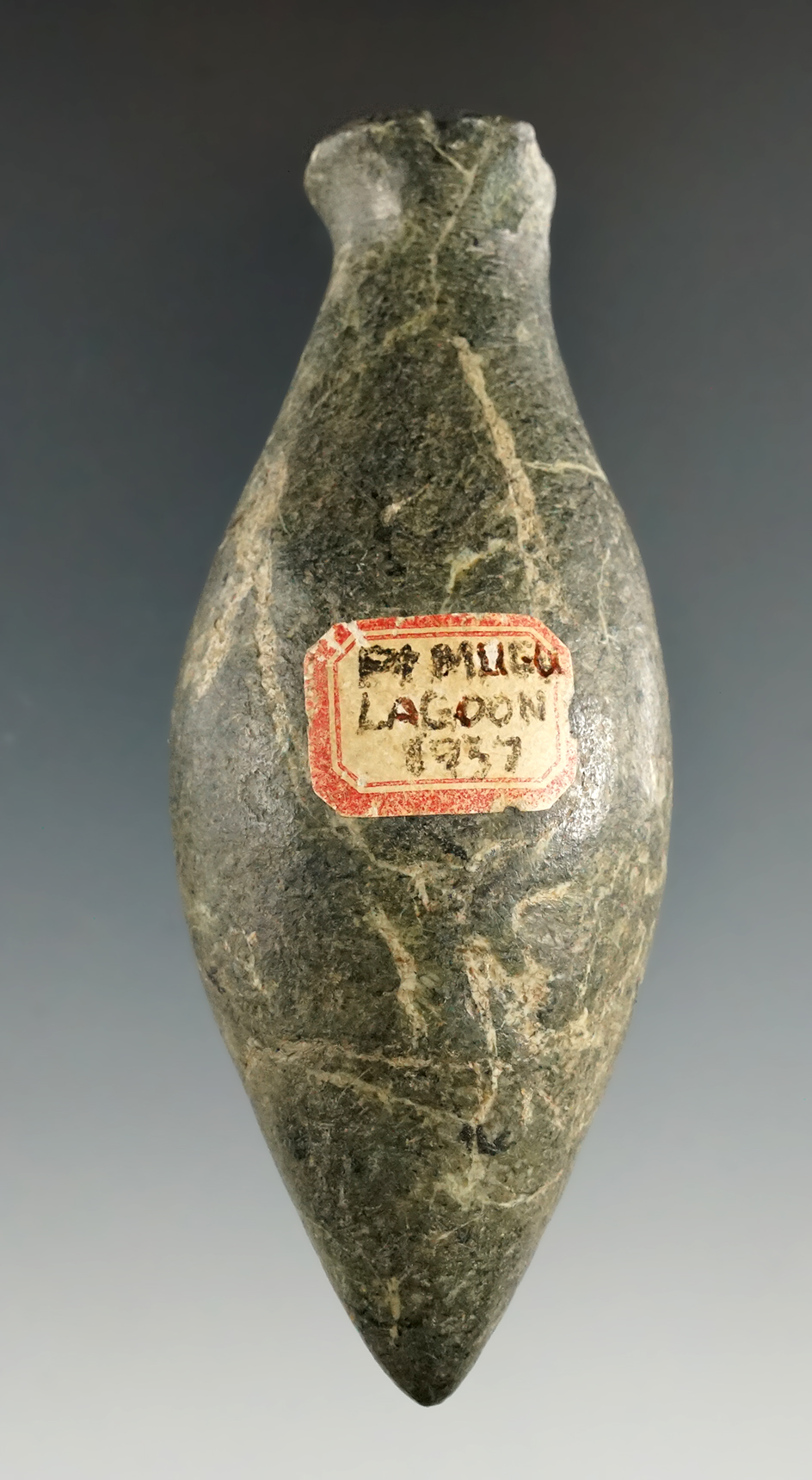 Beautiful material on this 3 13/16" Grooved Top Plummet found in Ventura Co., California.