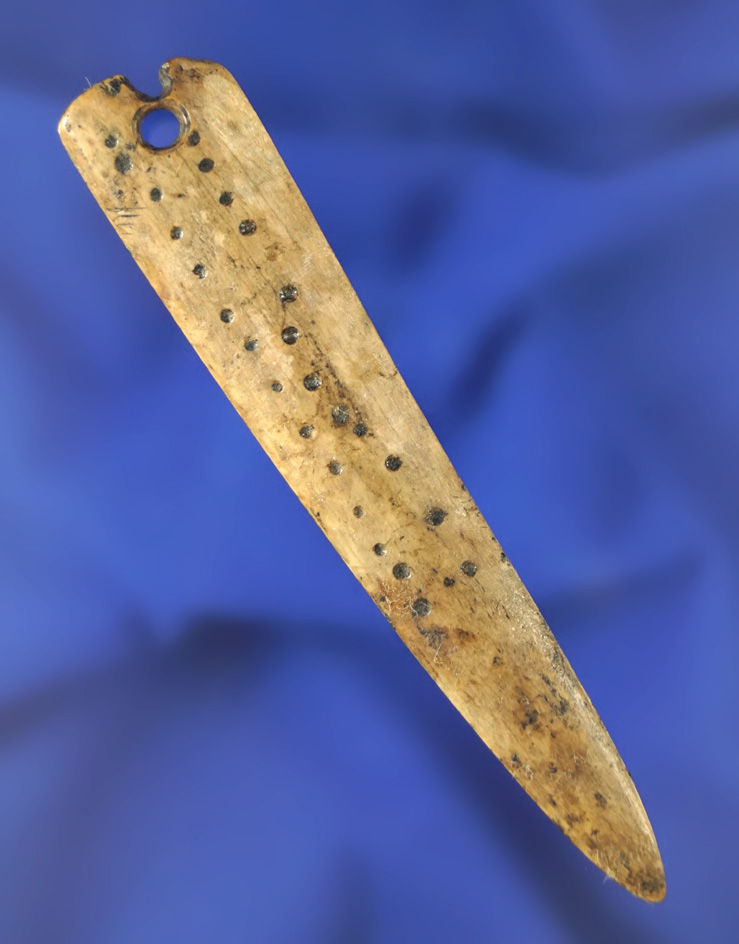 Highly decorated Bone Pendant with suspension hole that is well patinated found in Ft. Rock, Oregon.