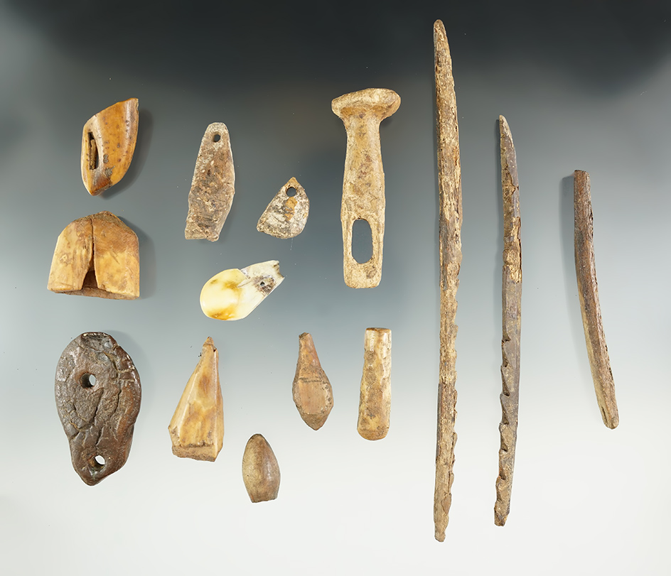 Group of assorted Inuit artifacts found in Alaska, largest is a 6 7/8" harpoon.