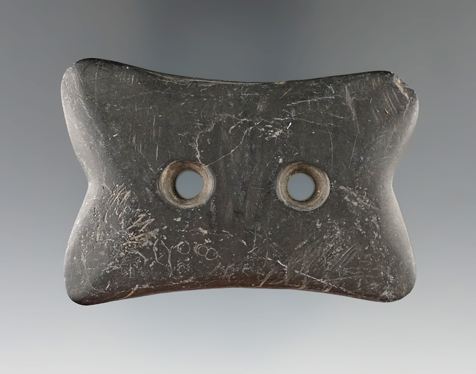 2 5/8" Hopewell Reel Gorget made from Black Slate, found in Indiana.