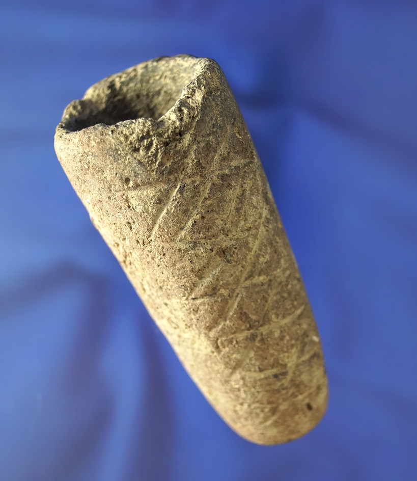 3 1/2" Mississippian clay pipe found in Ohio with cross-hatch engravings on two sides.