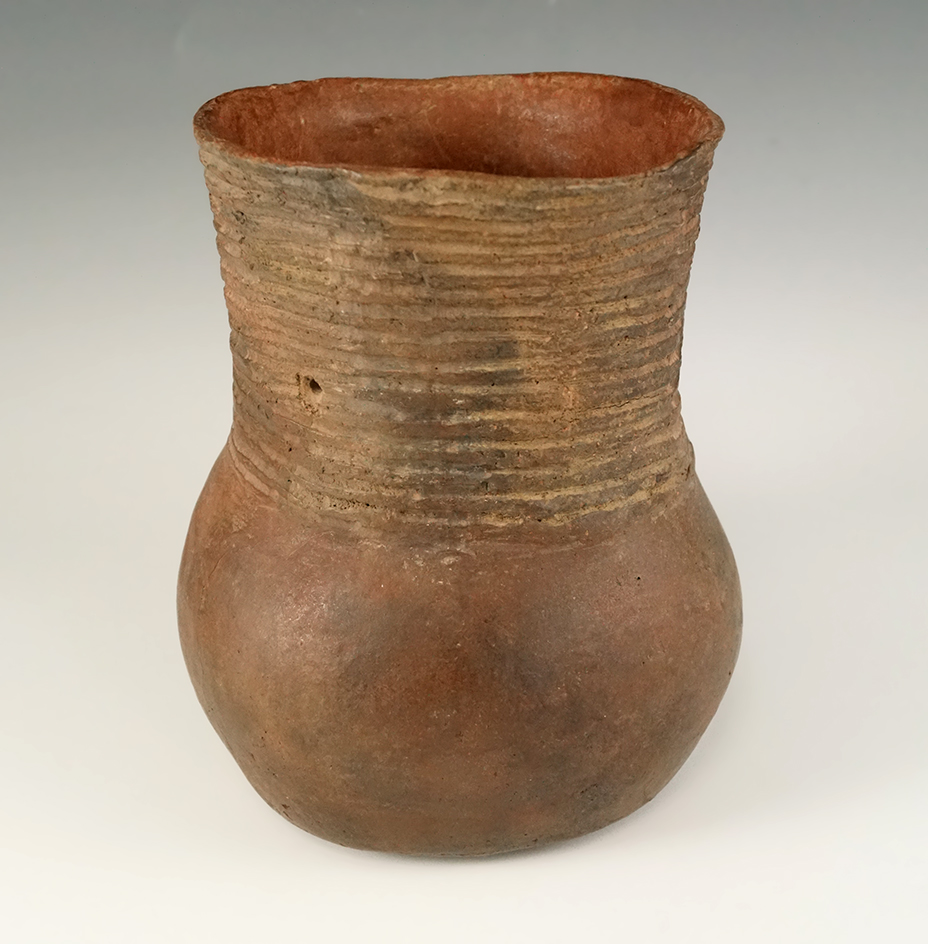 6 1/16" tall redware jar with nice exterior design found in Pike Co. Arkansas. Sam Johnson COA.