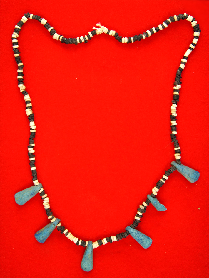 Beautiful Egyptian stone bead necklace from the 26th dynasty, circa 600 BC.  Six blue faience amulet