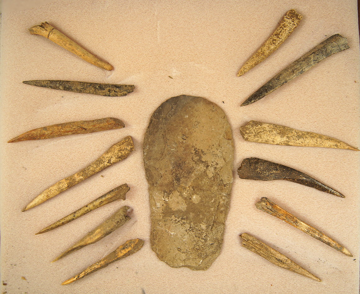 Framed set including  13 bone awls from a cave dig in Robertson County Tennessee, October 2003.