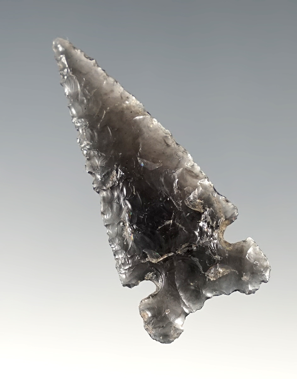 1 3/4" translucent obsidian Sidenotch that is well flaked in nice condition found in Oregon.