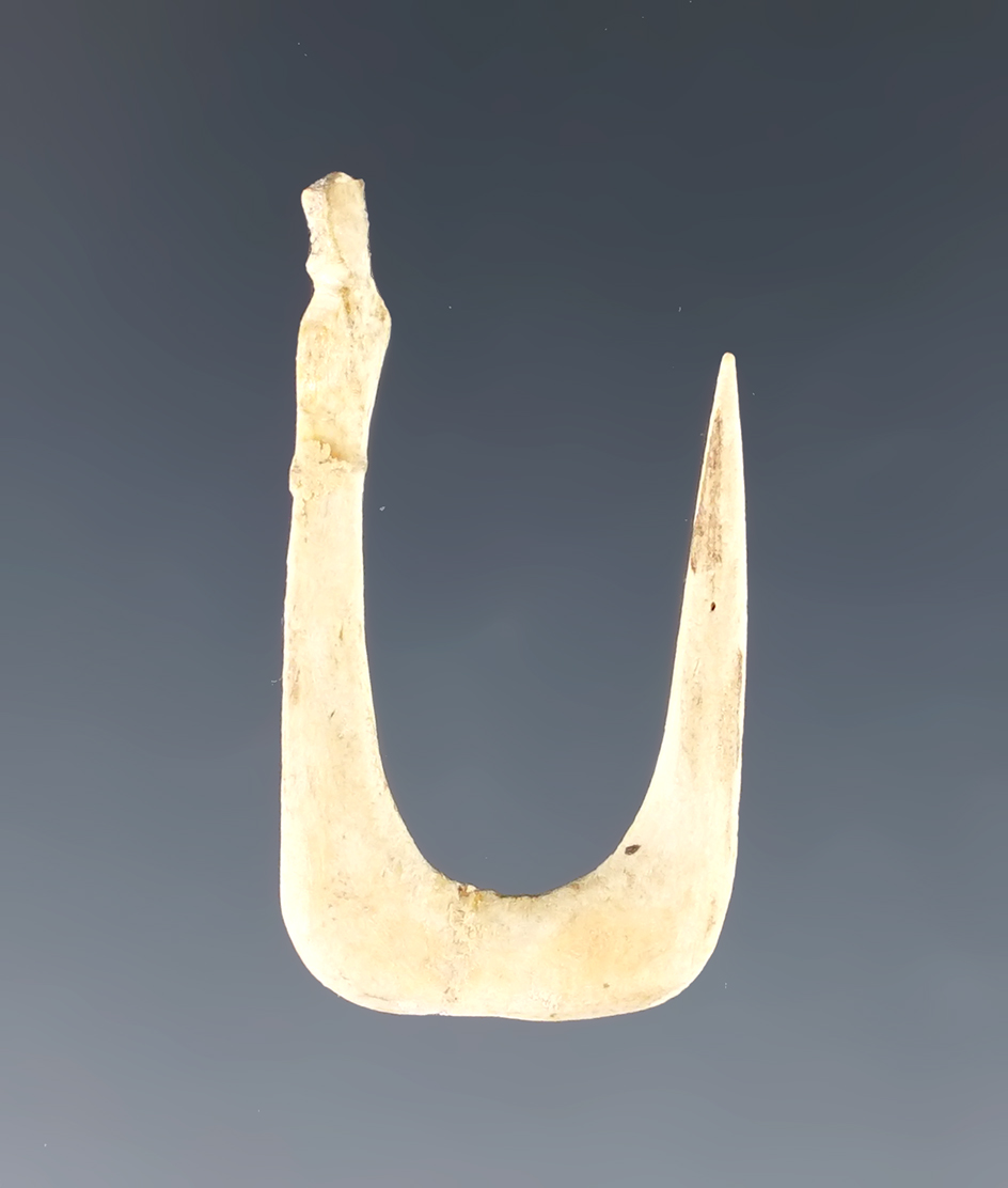 1 3/16" bone fishhook in very nice condition found in New York.
