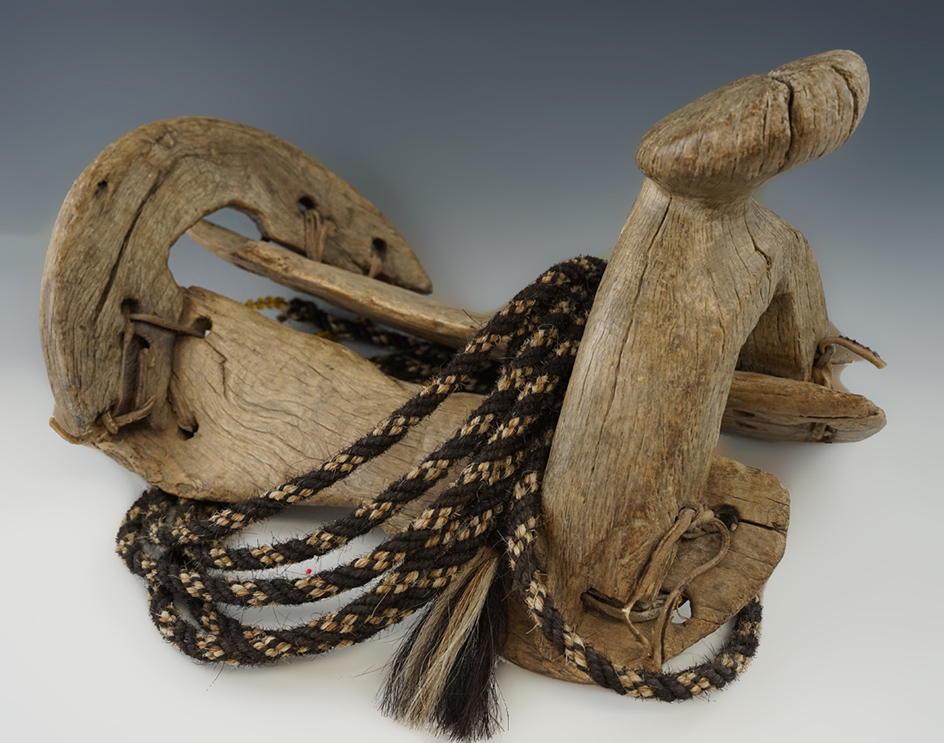 Rare! Circa 1800's Indian saddle with original rawhide attachments and a large section of rope.