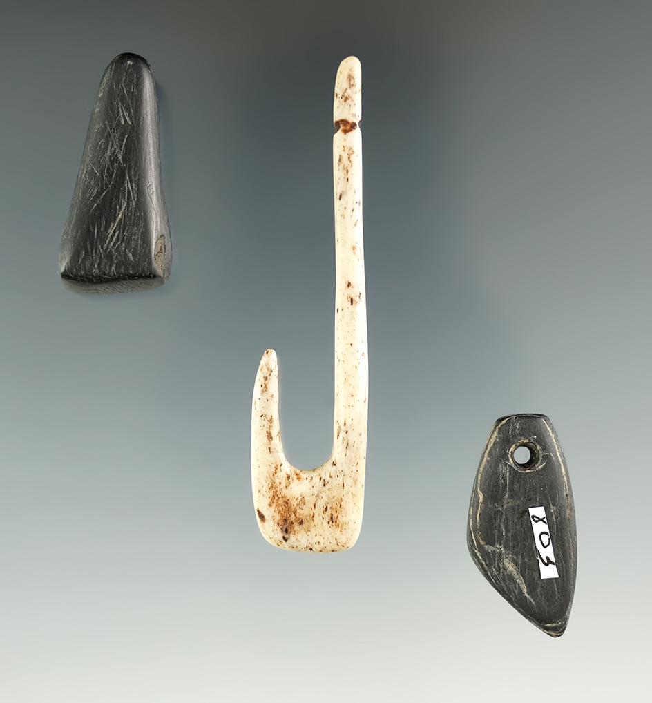 Bone fishhook and two Cannel coal artifacts found at a site in southern Ohio. Hook measures 2 5/8".