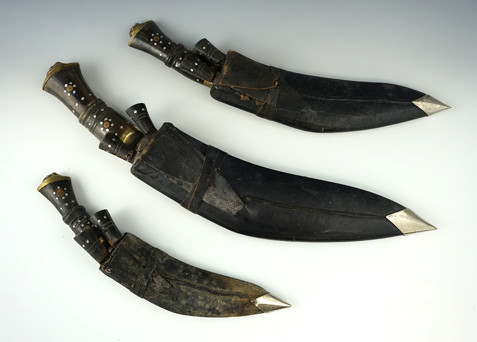 Matching set of three Gurkha knives and sheaths. Each sheath also includes two smaller knives.