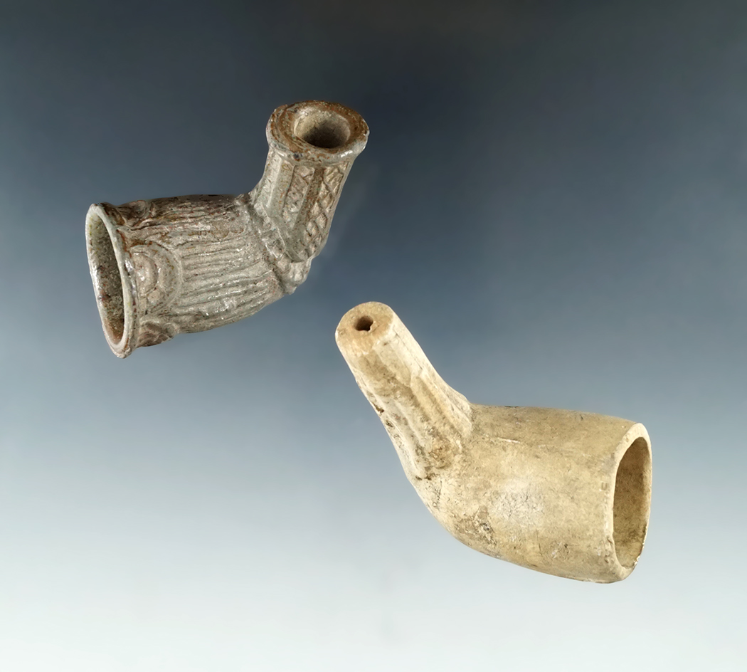 Pair of Clay Pipes, one has a shield and the other a face, found in Adams Co., Ohio,