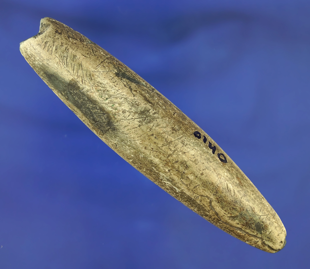 Heavily patinated 4 1/8" Elliptical Bar Atlatl weight found in Ohio. Made from slate.