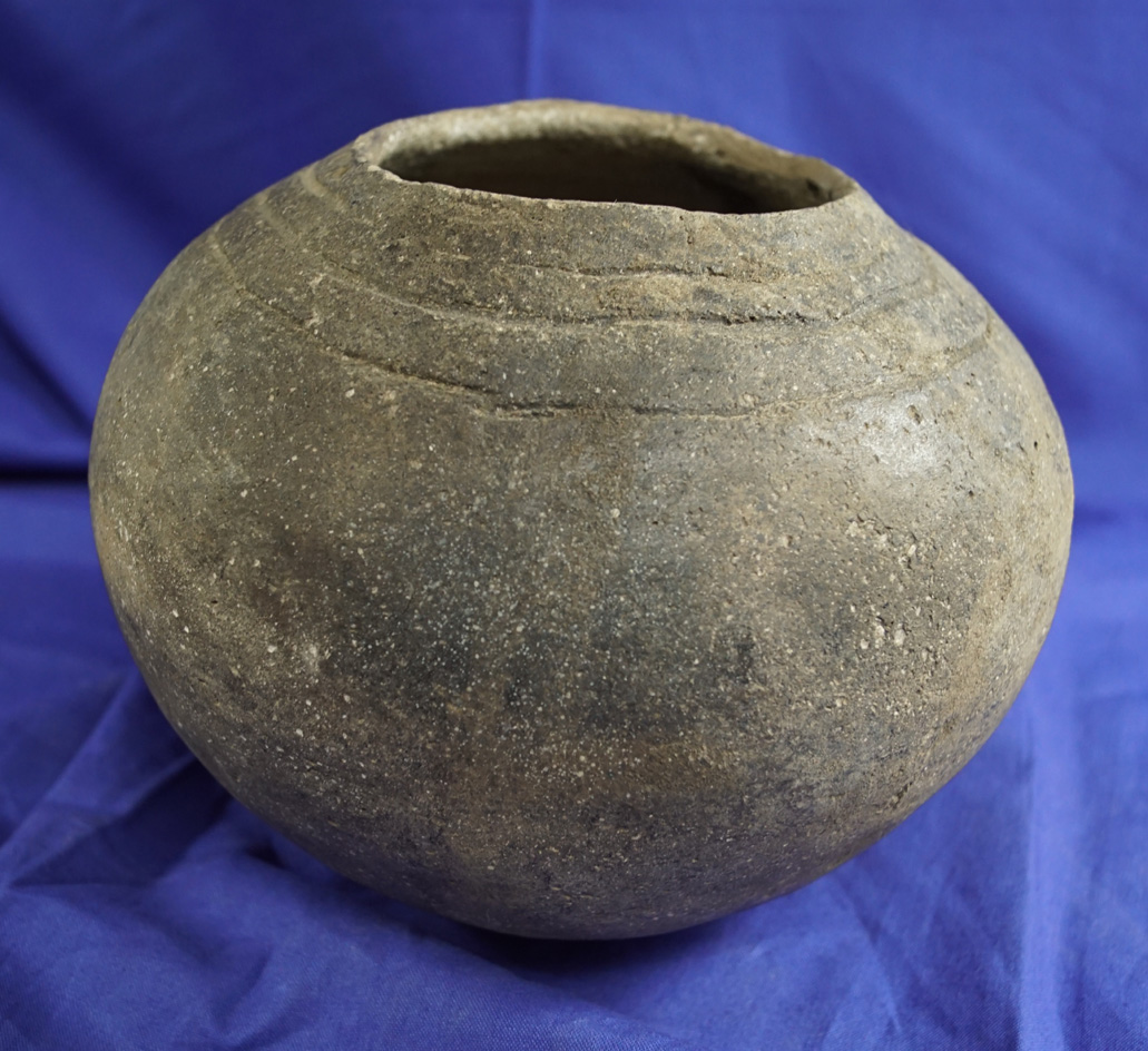 5 1/4" Tall Solid Mississippian Shell Tempered Clay Jar with suspension holes by rim.  Shipley.