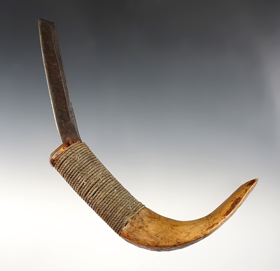 7 5/16" Long Curved Knife with hand carved wood handle, and a cord wrapped metal blade. 