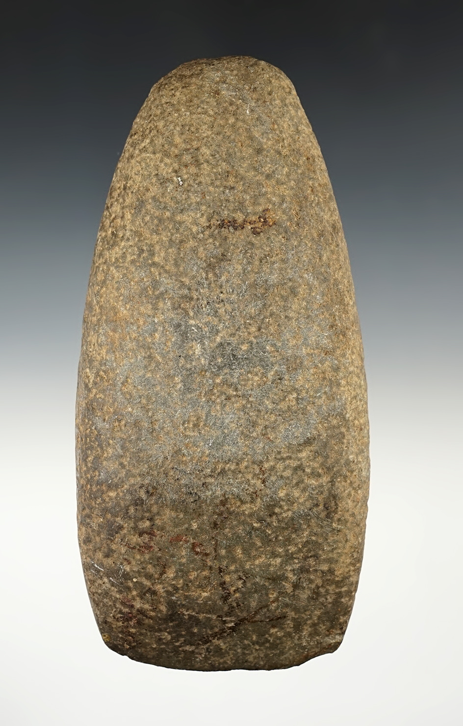 Well made 6 1/2" Hardstone Celt that is fluted on one edge. Found in Iowa.