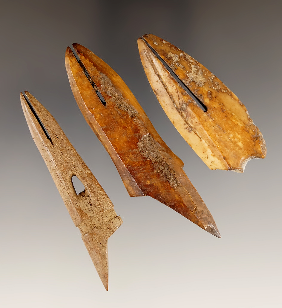 Set of three ivory and bone toggles, one is damaged. Largest is 2 7/8", found in Alaska.
