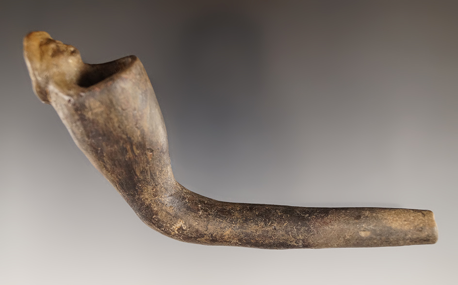 5" Clay pipe with some restoration to effigy and a mended stem. Found in New York.