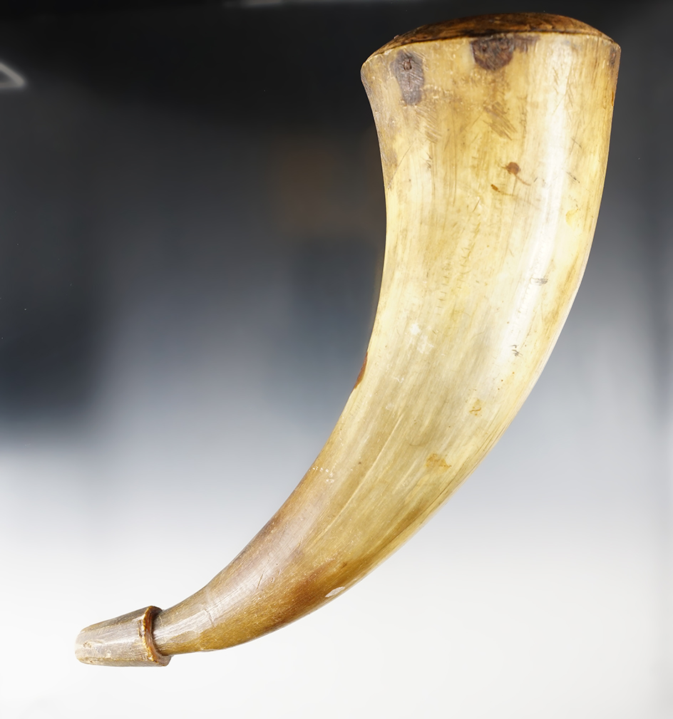 10 1/2" tall vintage powder horn with original wood cap.