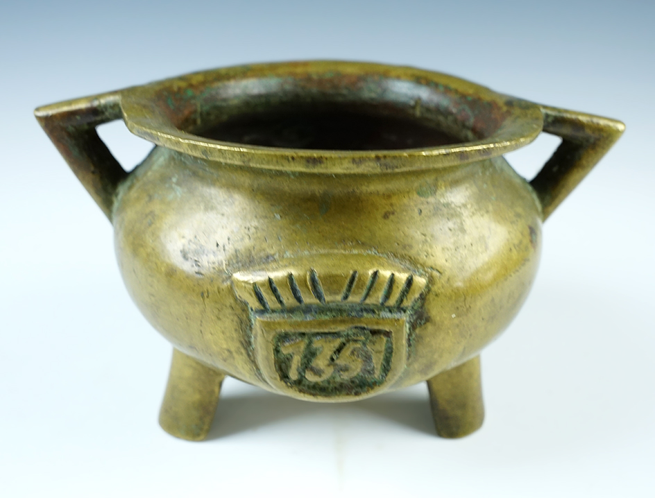 Vintage 7 3/8" bronze tripod base handled bowl. Age and affiliation unknown.