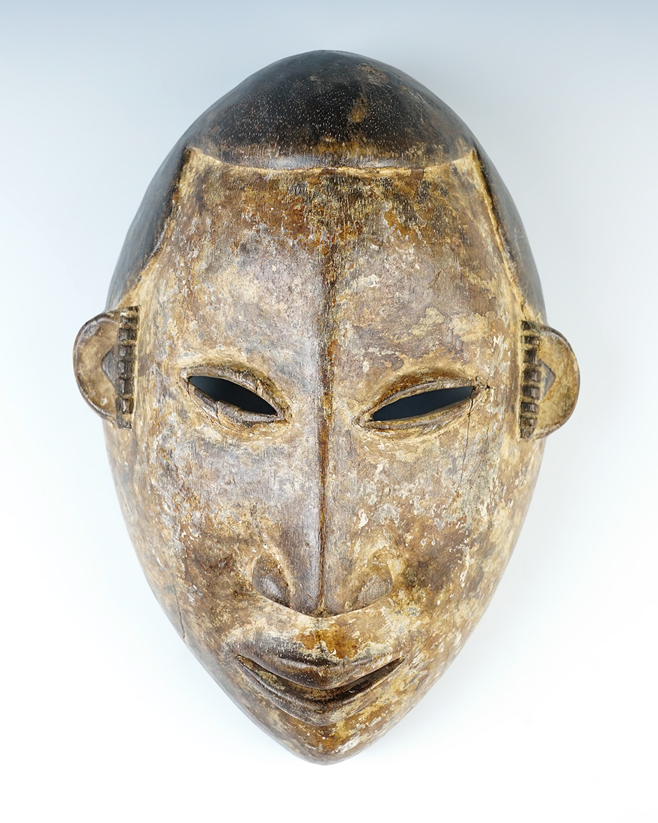 11" tall Ibo Tribe hand carved wood "maiden mask". Circa 1900-1925. Nigeria, Africa.