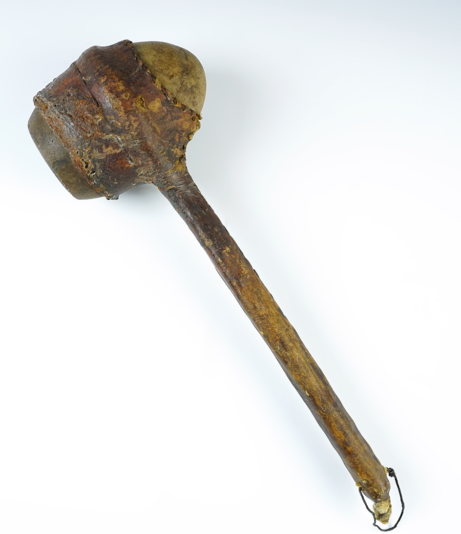 12" Sinew sewn leather wrapped quartz hammer with original handle. 