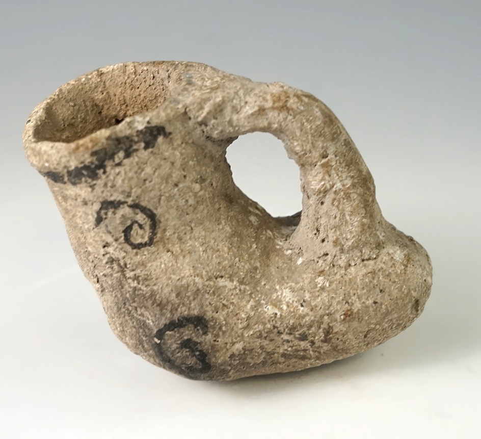 Miniature 2 1/4" long Anasazi black and white pottery vessel found in Arizona.