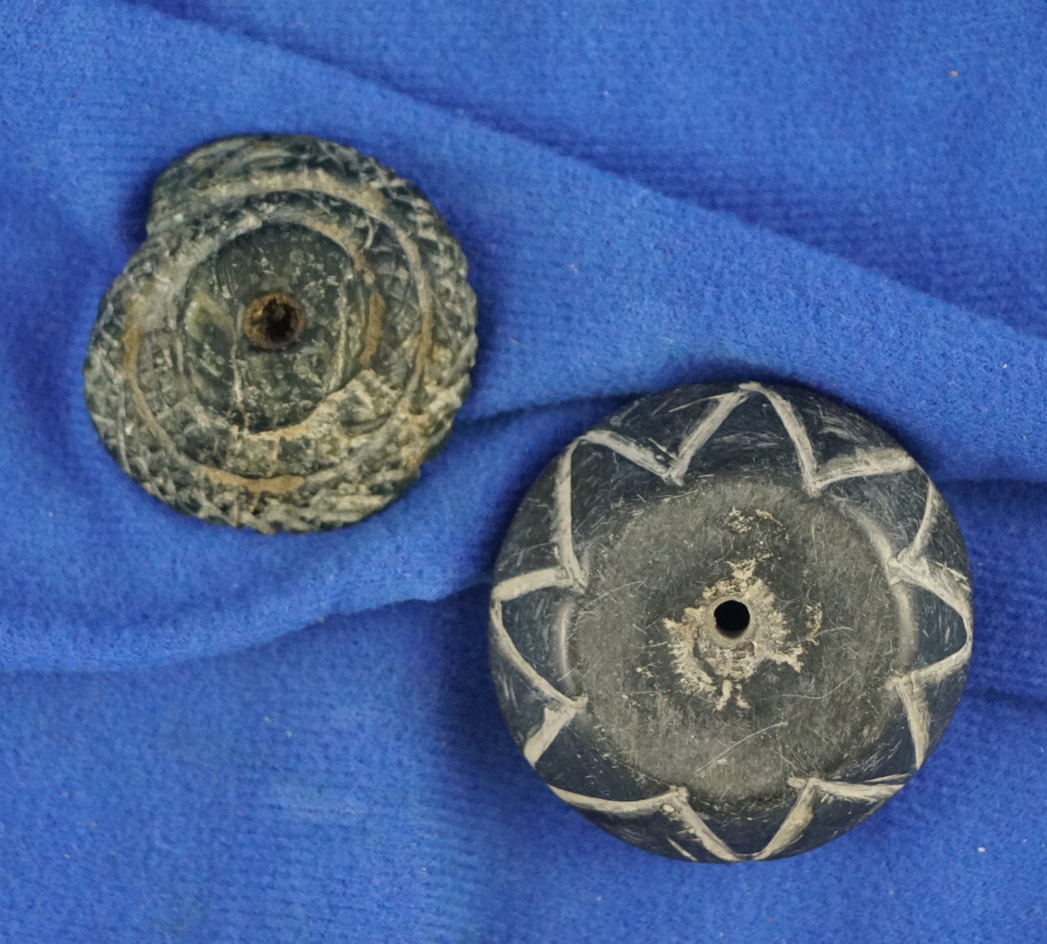 Pair of decorated pre-Columbian stone spindle whorls or beads, largest is 1 3/4".