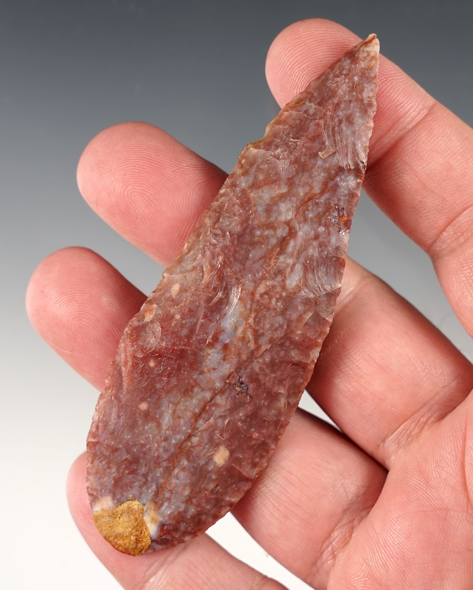 3 13/16" Beveled Knife made from colorful Alibates Flint. One spot of restoration filler to base. 