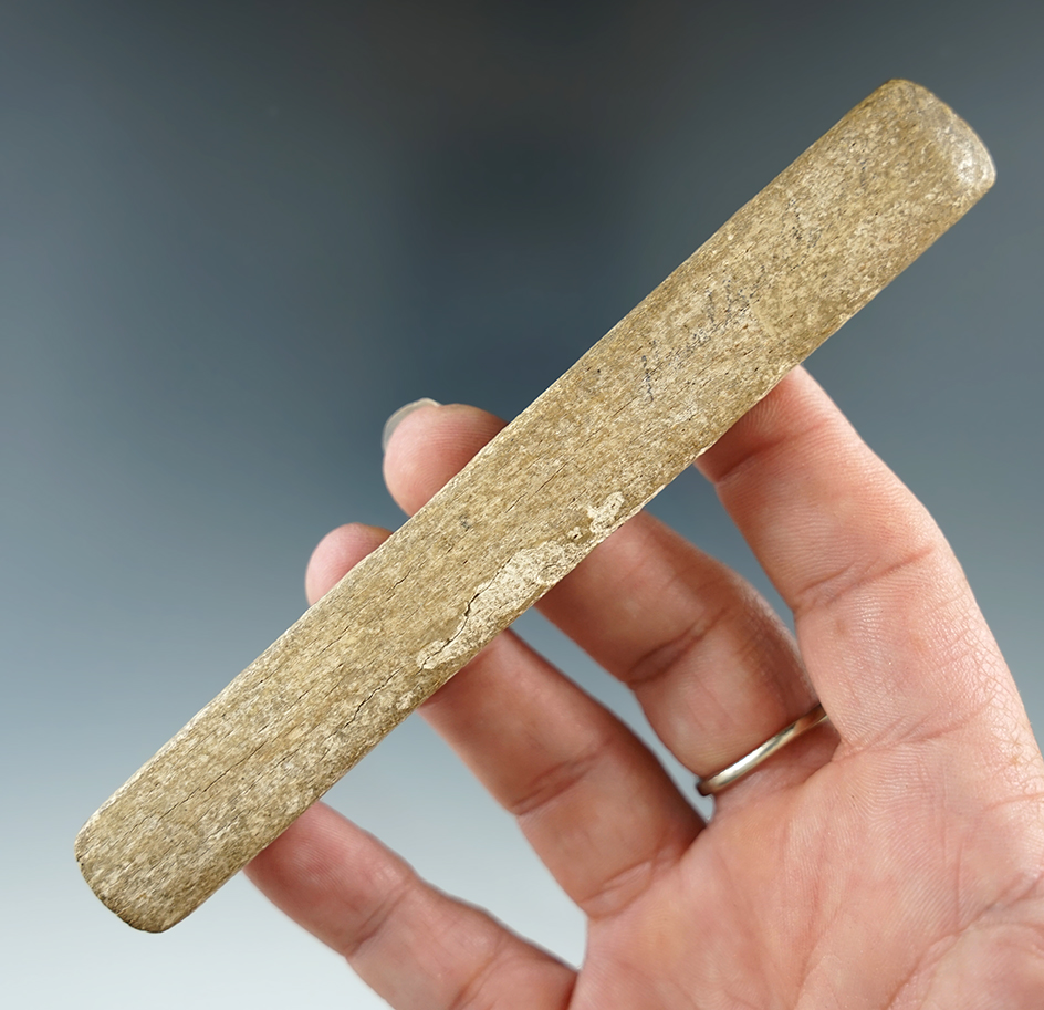 5 1/16" bone double-bit chisel found in Kentucky. Uniquely carved finger grips.