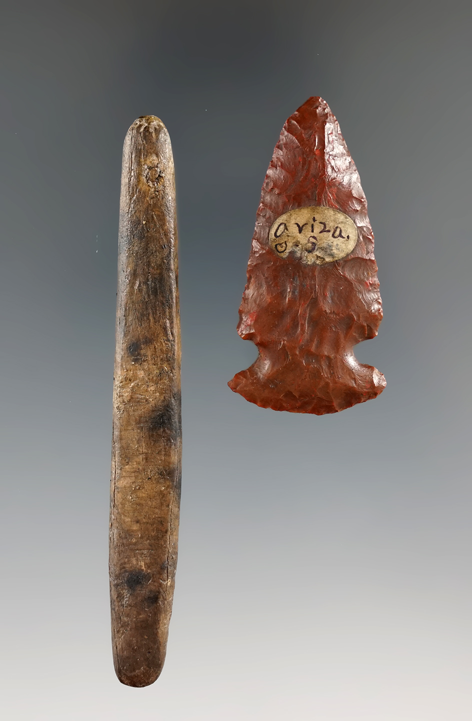 Pair of Arizona artifacts including a 3 1/4" bone pin and a 1 13/16" Jasper arrowhead.