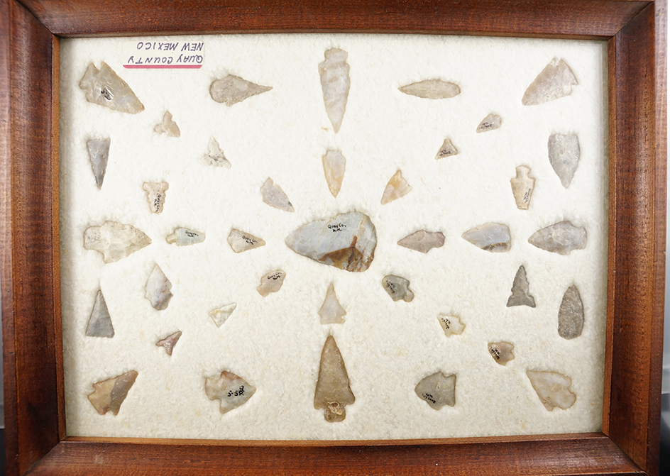 Set of 39 points found in Quay Co., New Mexico, housed in an old wooden frame.