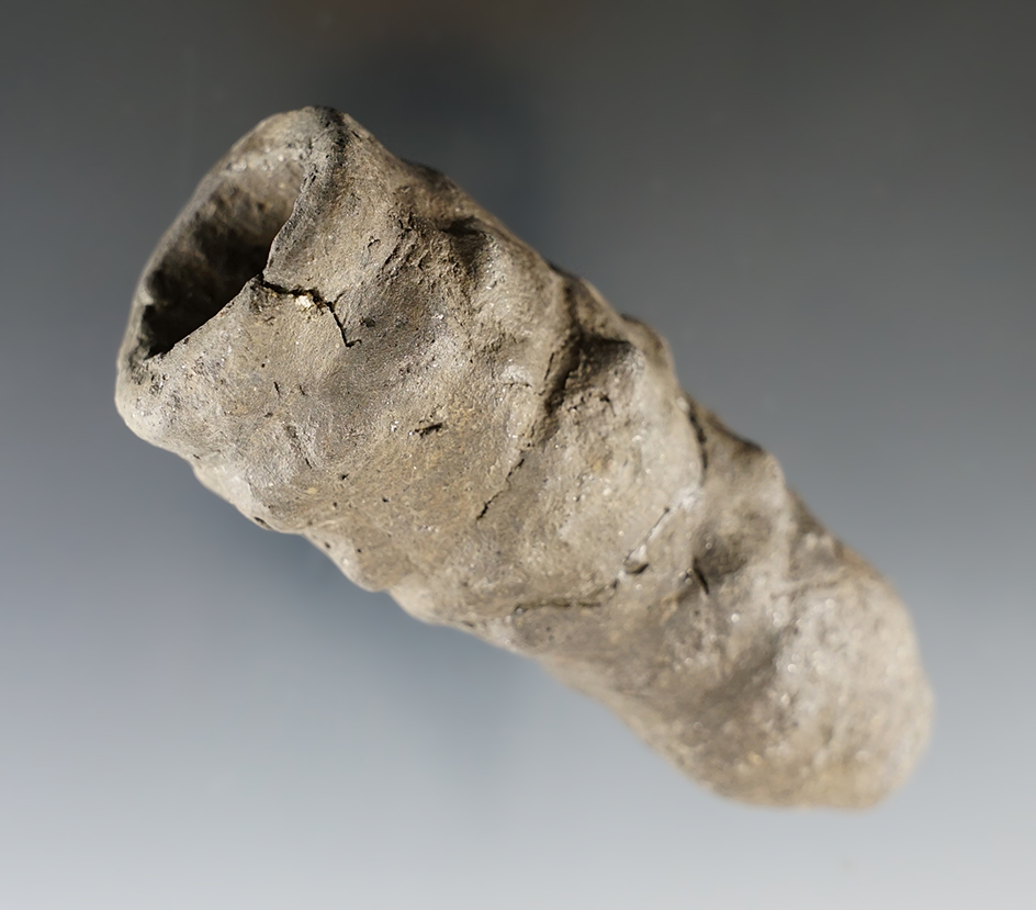 4 1/8" Clay blocked end pipe that is broken and glued tight at the middle. Found in New Mexico.