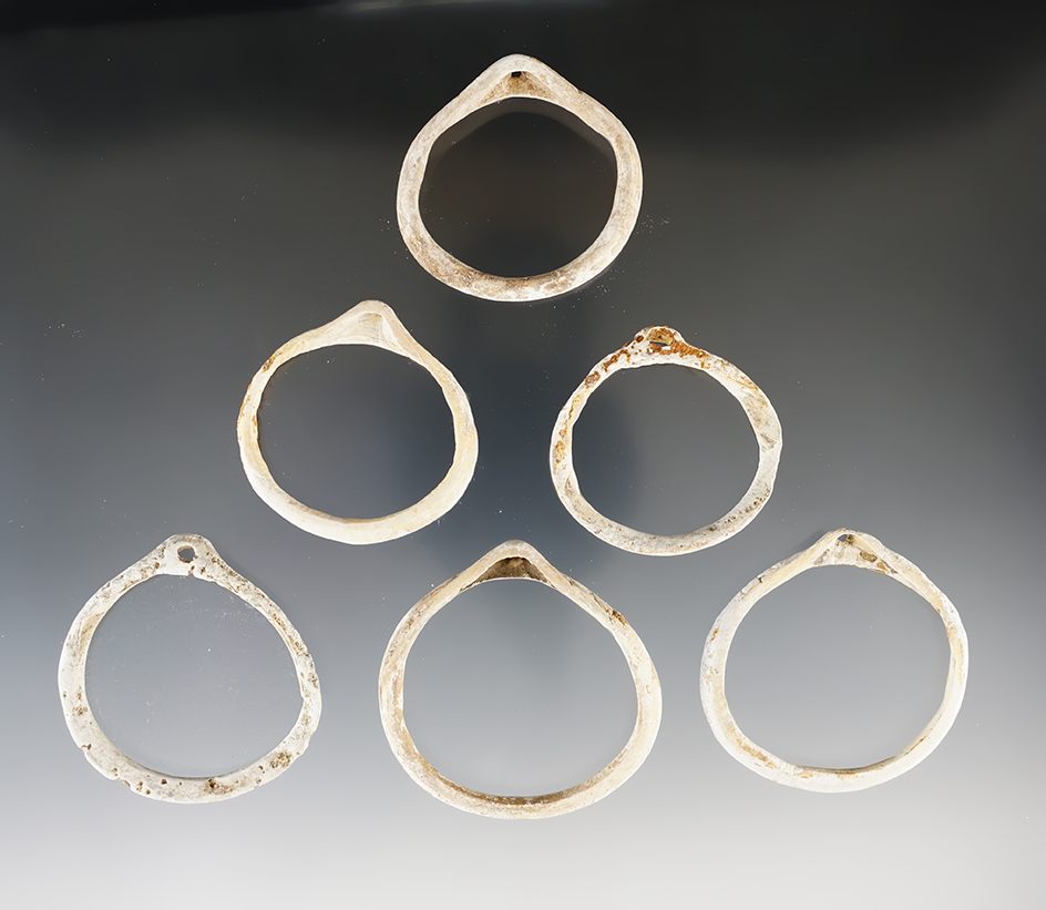 Set of six cut shell ornaments found in New Mexico in nice condition. Largest is 2 1/8".