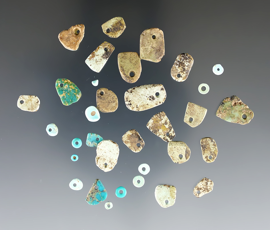 Group of mostly turquoise ancient drilled beads and pendant found in New Mexico.