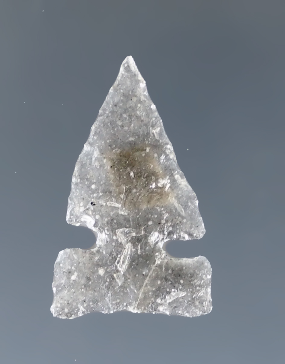 Thin and exceptionally well flaked 13/16" side notched point that is very thin found in New Mexico.