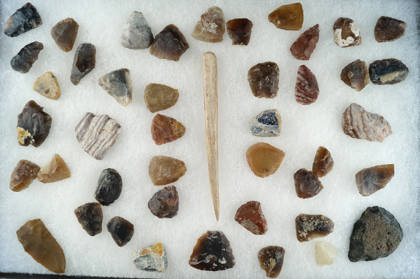 Group of thumb scrapers and a 4 3/8" bone awl found in Kansas from the Eulert collections.