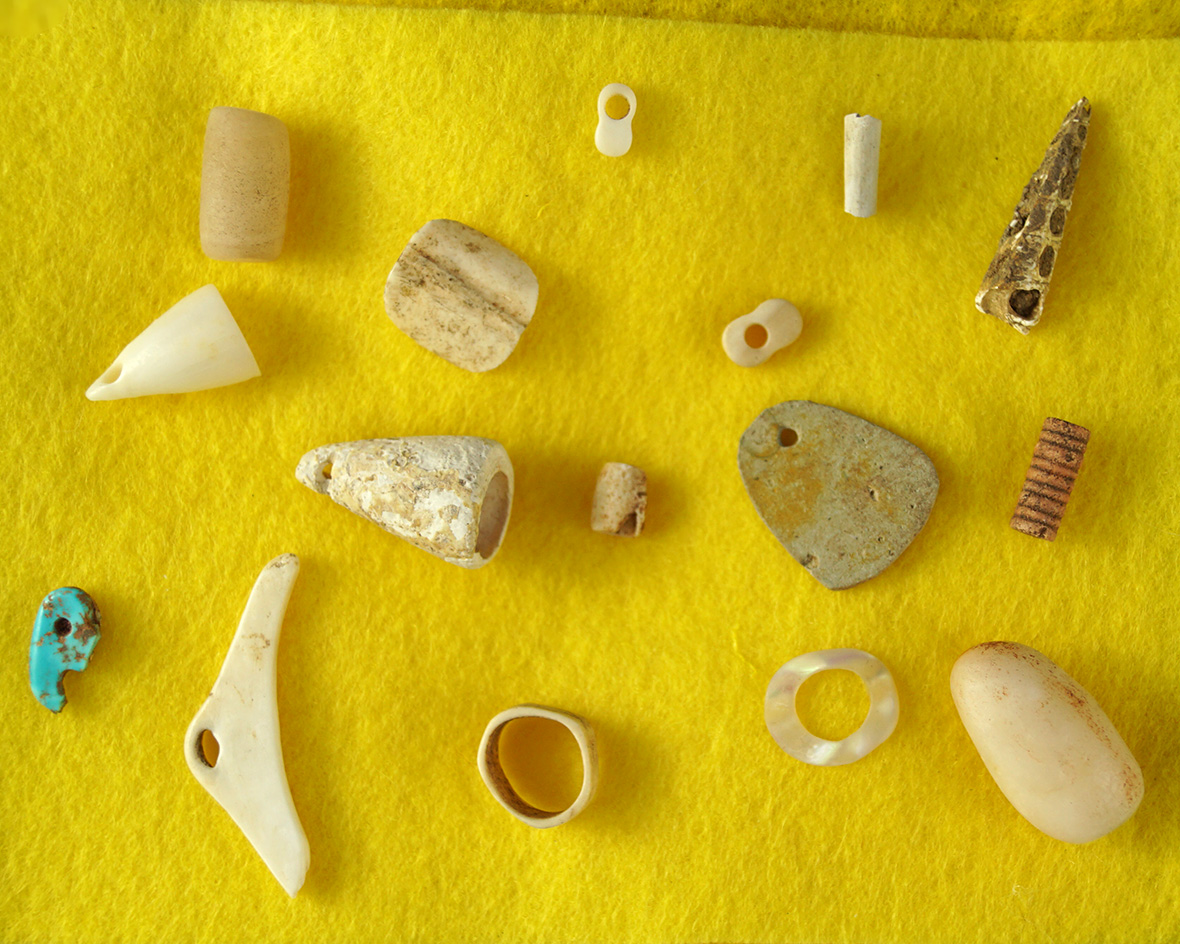 Nice selections of assorted bone and stone beads and pendants found on Anasazi sites in Arizona.