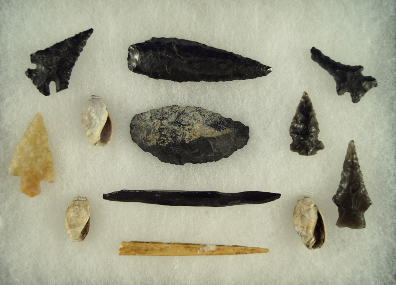 Group of assorted projectile points, knives and awls found near Klamath Lake Oregon.