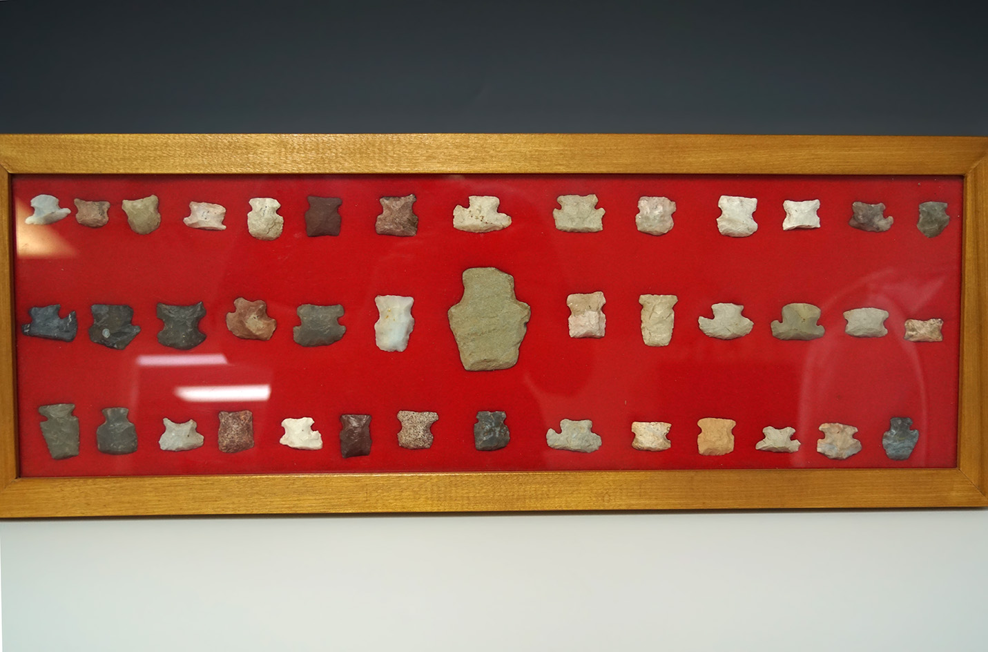 Nice framed set of 41 Ohio area hafted scrapers, largest is 2 1/8". Display case is 8" by 20".