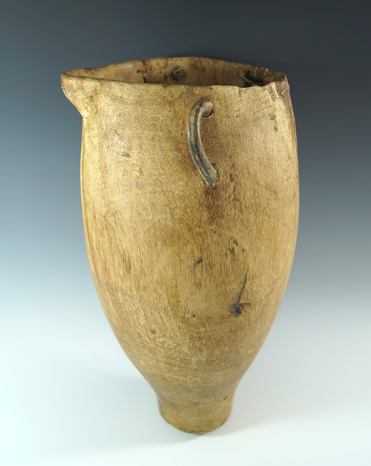 Very old! 11 1/2" pitcher carved from a single piece of wood! Very nice display item.