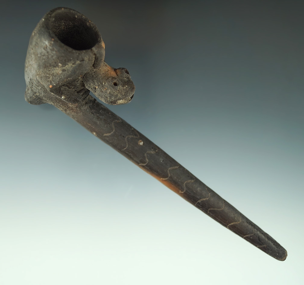 Display item - 6" long clay frog effigy pipe. This is a tourist item from Mexico - still displays we