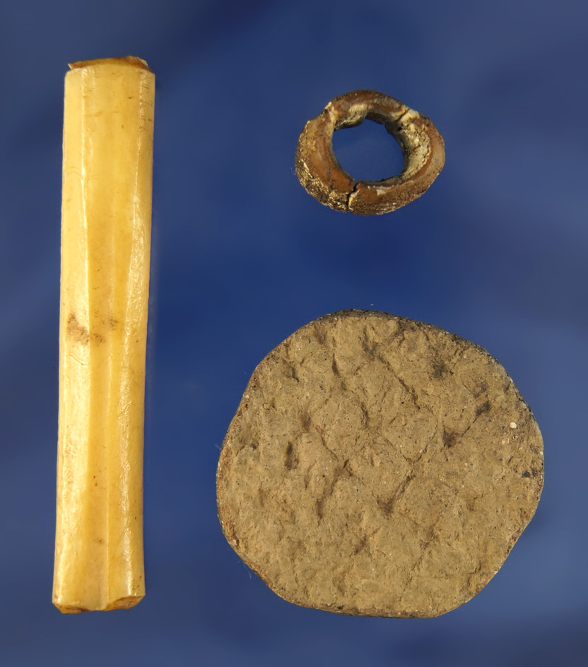 Set of three Artifacts found in Kentucky including two bone beads and a clay pottery disc.
