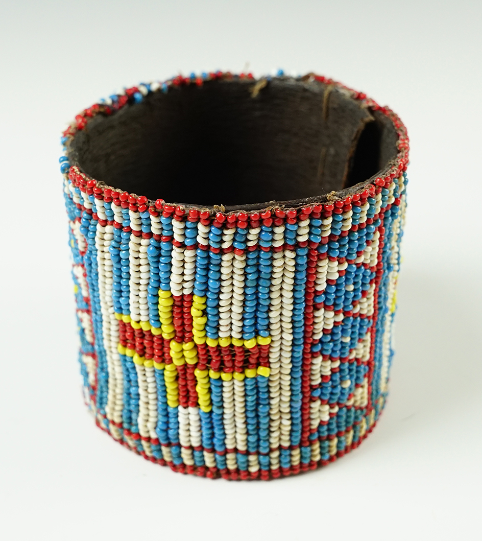 Beautifully beaded 3 1/4" x 2 5/8" beaded leather wrist/arm band in very nice condition.