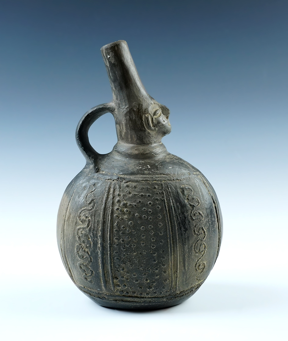 8 1/16" tall x 5" wide Chimu handled water bottle with excellent detail. Solid condition.