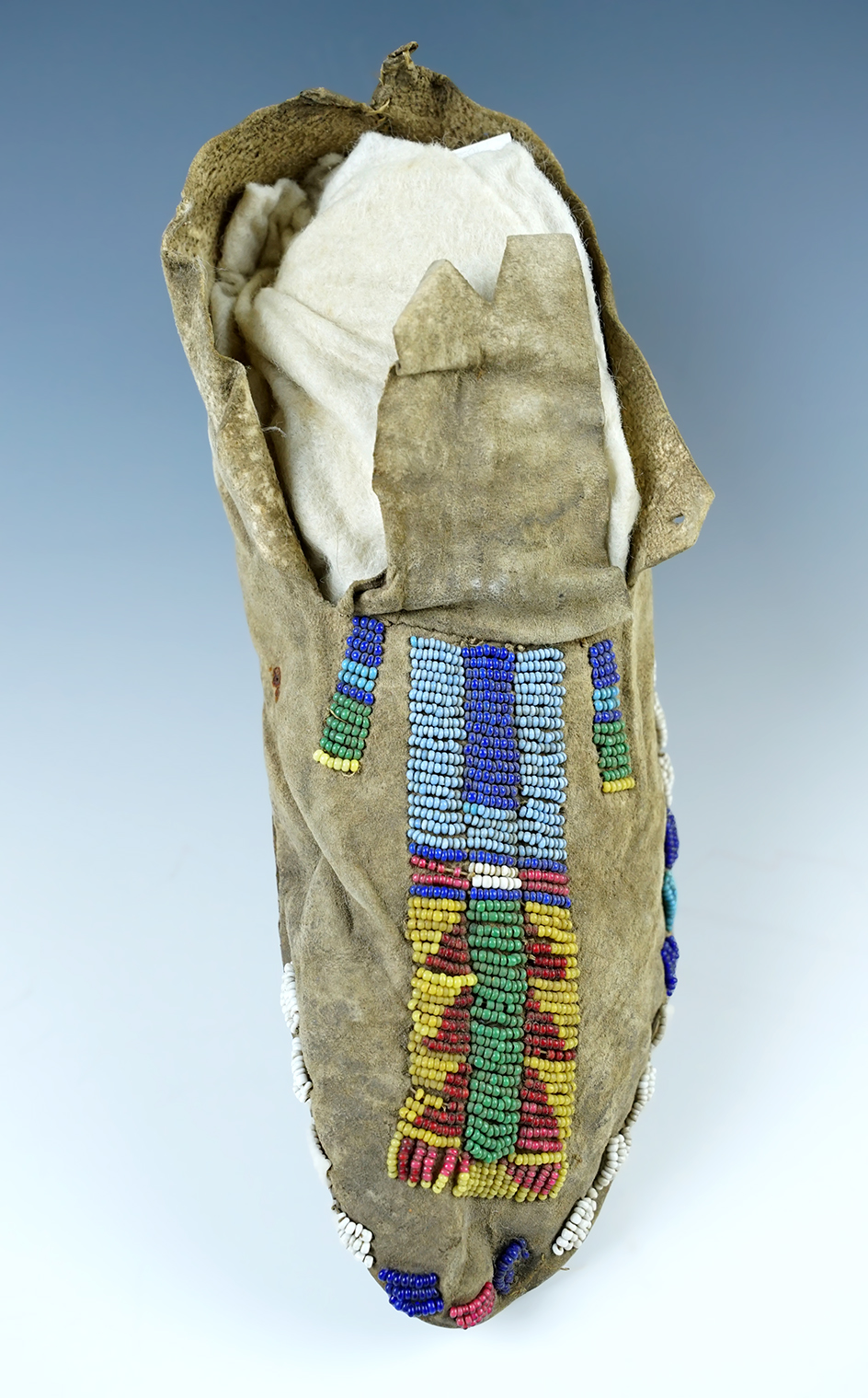 8 3/4" Moccasin that is Sinew Sewn with no bead loss. Nice early yellow Greasy Beads.