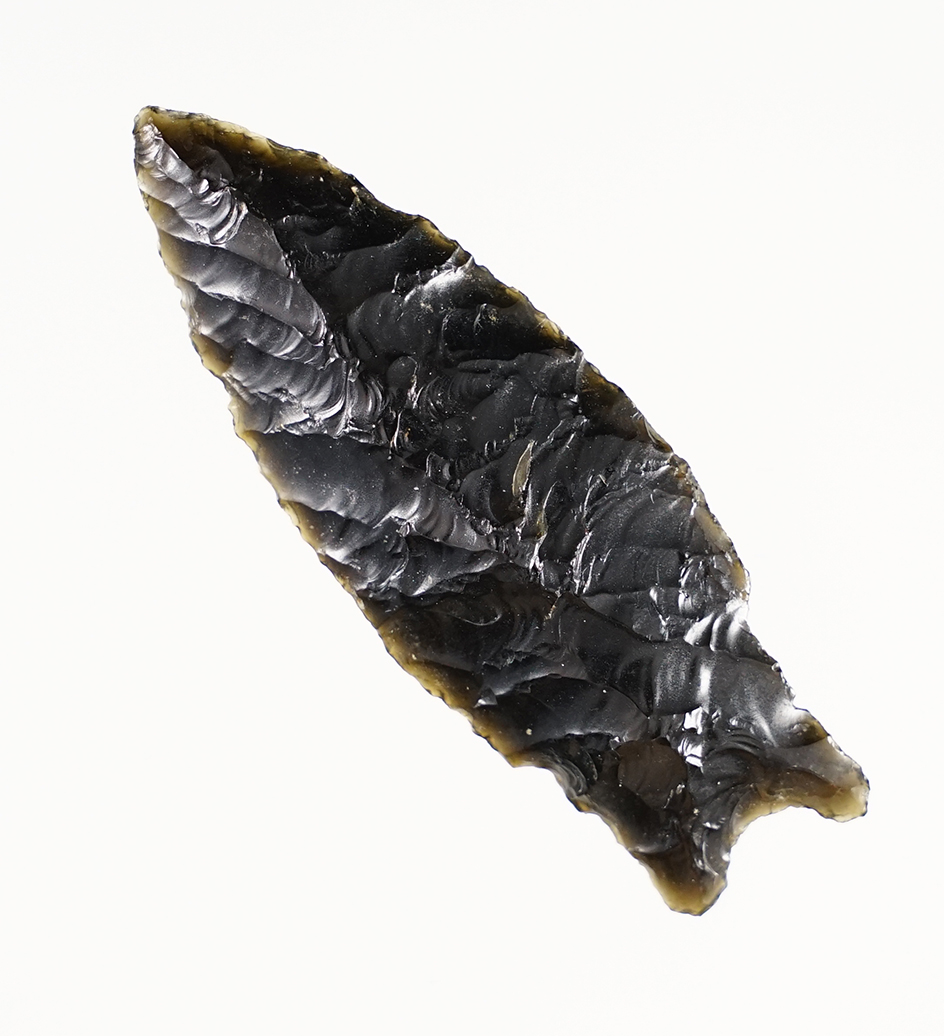  2 7/16" Paleo Windust with nicely ground stem area made from obsidian. Found in Oregon.